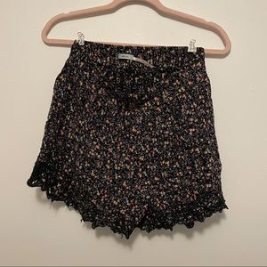 Black flowy shorts with Tony floral print